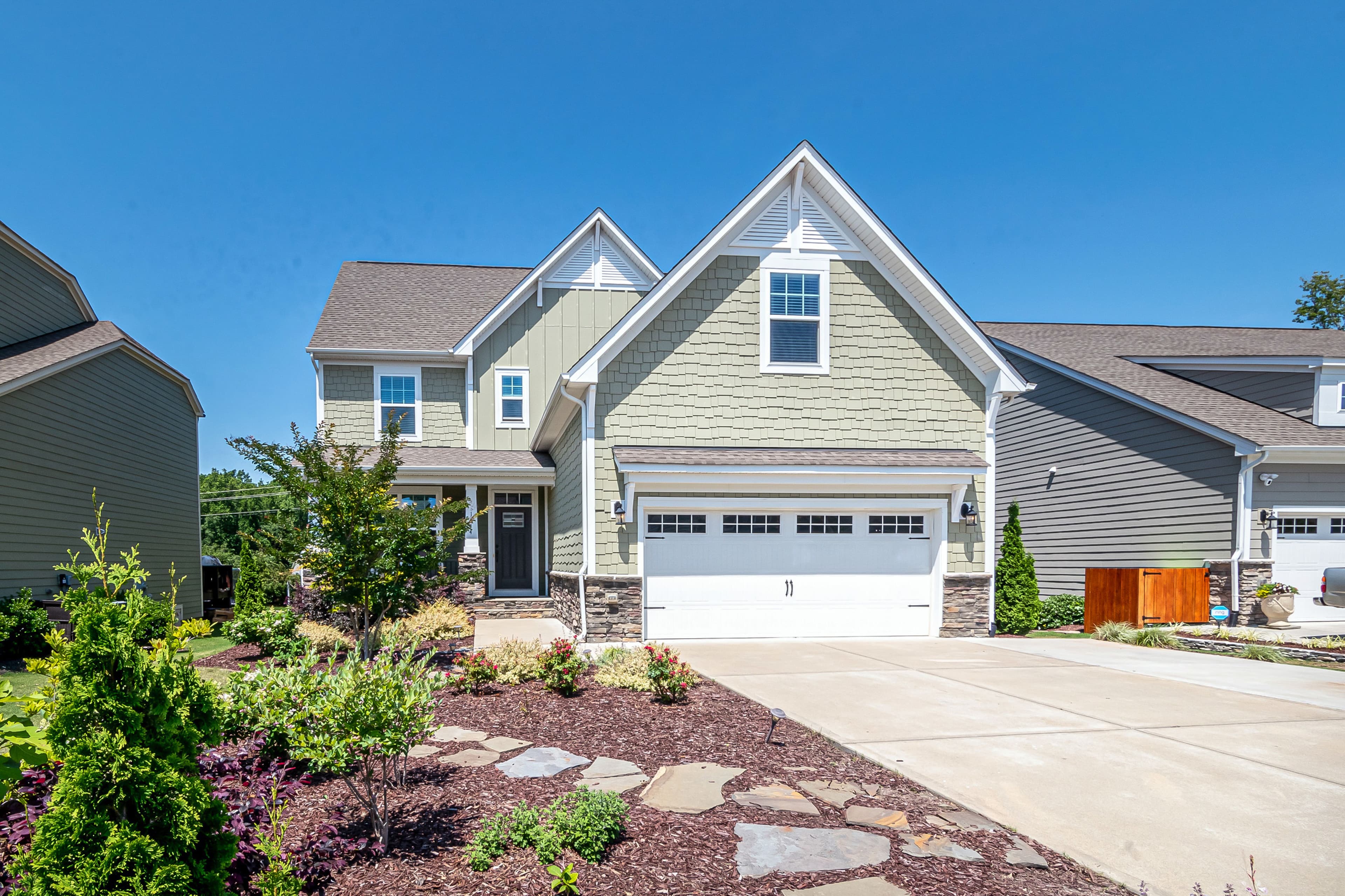 Generic stock photo of a house's garage door, not specific to this business
